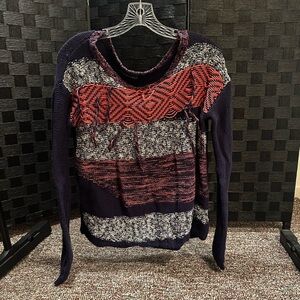 Small orange, white, and blue sweater